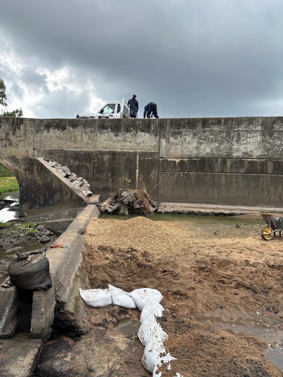 Spillway repair area with sandbags forming the edge of the working area